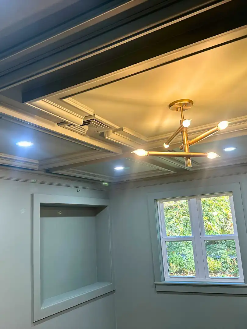 Dark painted coffered ceiling with detailed molding and built-in niche — interior trim and ceiling painting by SIB PRO PAINTERS, Warminster, PA