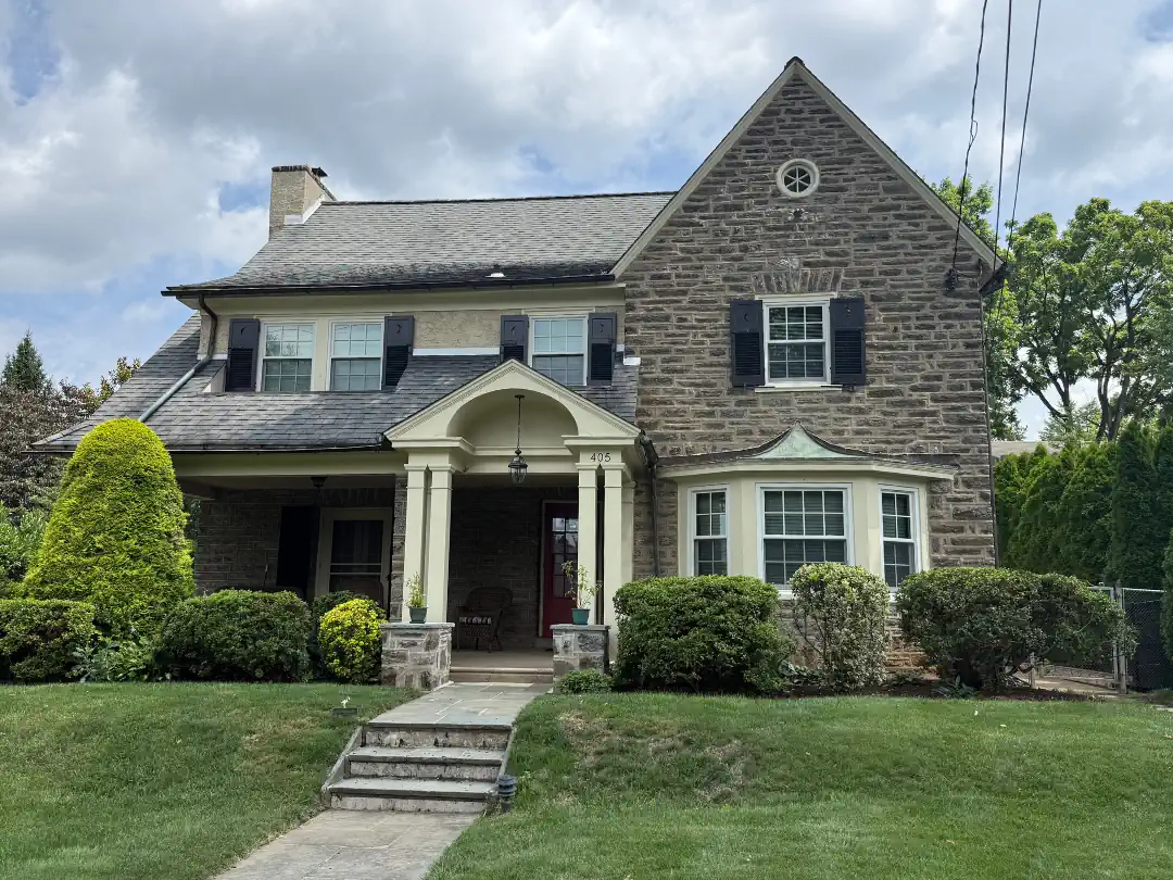 Historic stone colonial home with freshly painted trim and shutters — exterior painting by SIB PRO PAINTERS, Bucks County, PA