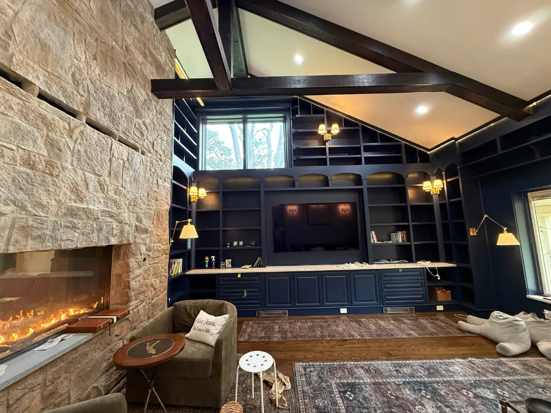 Dark navy built-in bookcase and library wall painted by SIB PRO PAINTERS — interior painting in Bucks County, PA