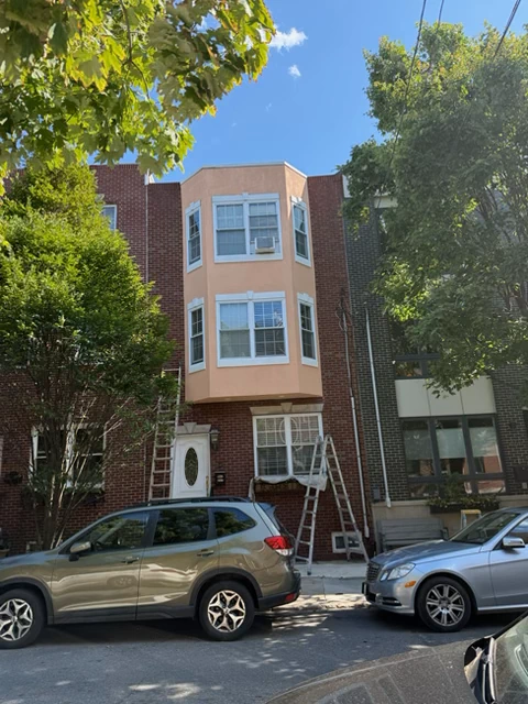 Exterior home repaint with clean trim lines in Philadelphia, PA by SIB PRO PAINTERS